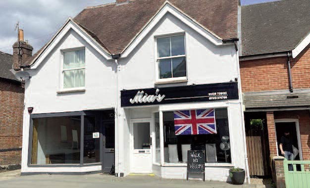Freehold investment property comprising two shops and flats for sale in Haslemere, Surrey